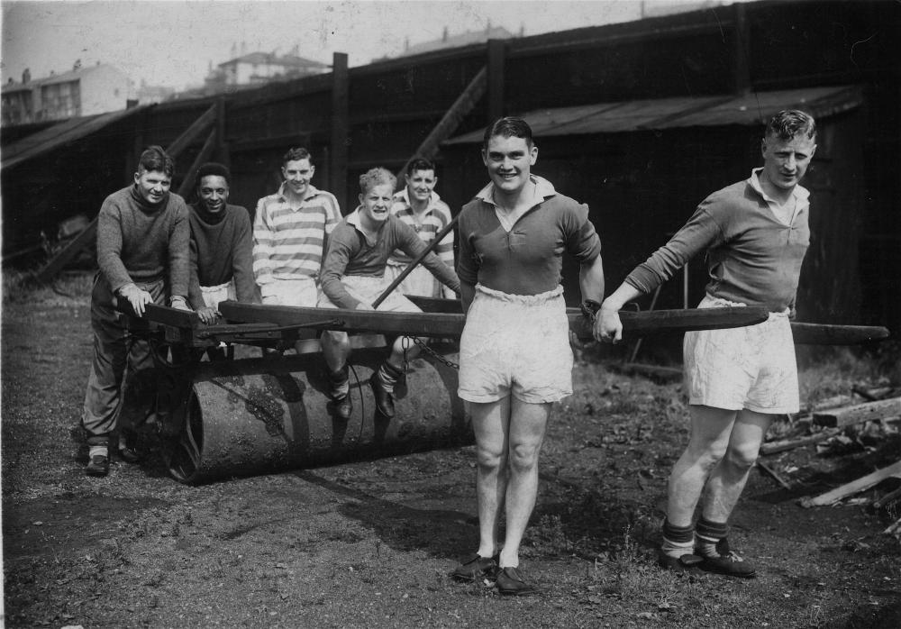 Wigan Welsh Rugby League players 1938, rolling out the roller at Central Park.