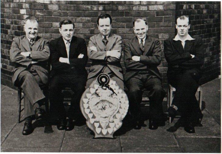 Comm Members, Moss Lane 1950, with the Laithwaite Trophy.