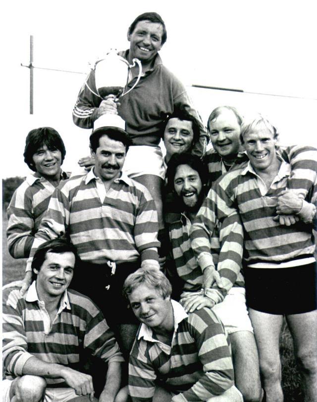 Springfield coach Ken Halliwell proudly shows off the trophy after coaching his team to victory in a seven a side tournament 1981.