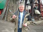 Tony Haslam with the arrow that was fired by Fred for BBC documentary (97K)