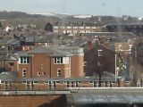 View over Wigan centre towards snow-covered hills. (Rivington?)