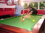 Playing pool for a small wager
