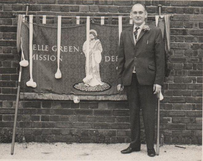 Harold Green with Belle Green Banners in the school yard.