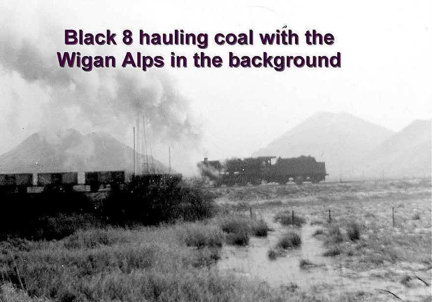 Black 8 hauling coal with the Wigan Alps in the background.