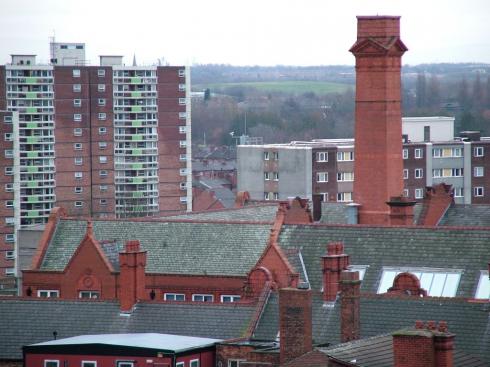 Flats at Scholes and chimney on Wigan Town Hall
