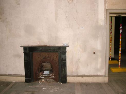 Old fireplace, note props in background