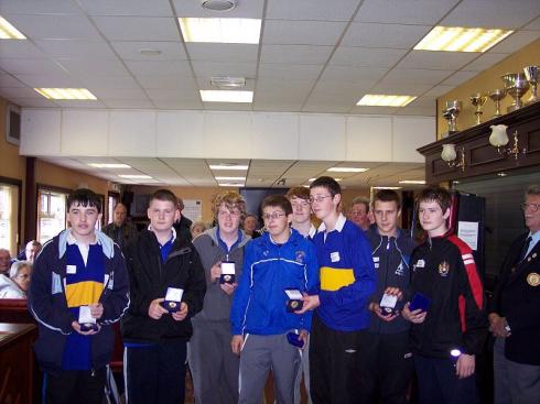 Receiving medals in the clubhouse